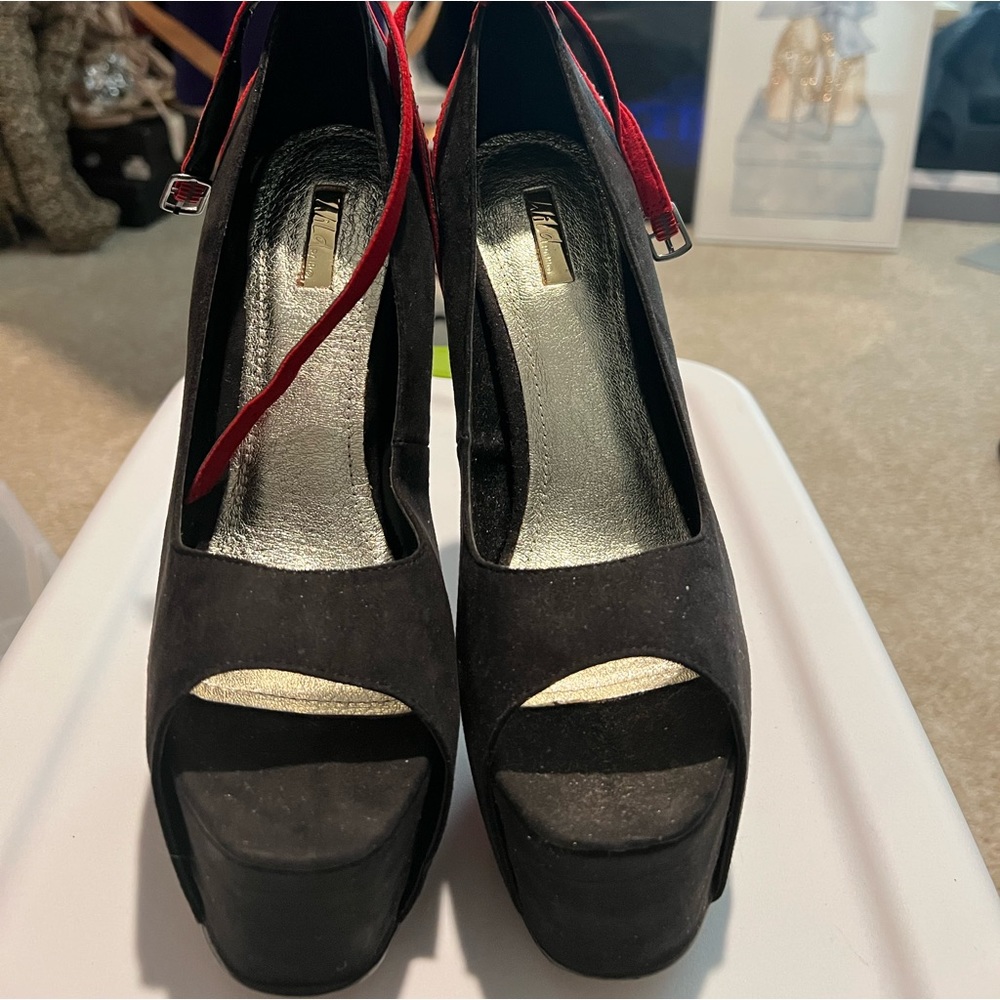 Suede platform peep toe pumps with ankle straps.
